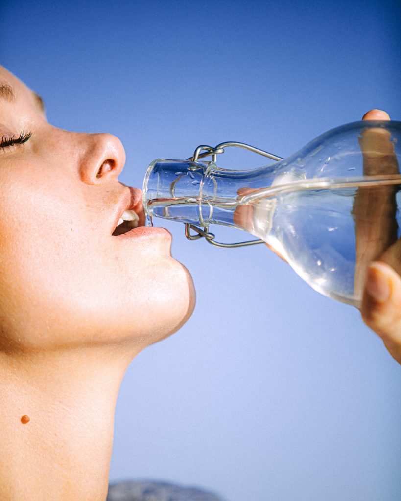 lady drinking water from bottle
